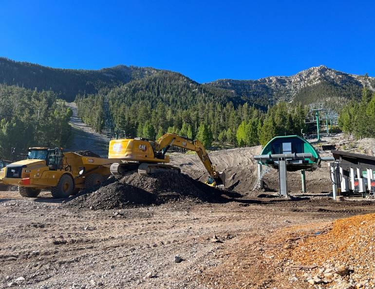 Removing the massive amount of material that flowed into the base area at Lee Canyon, Nev., in the wake of Tropical Storm Hilary.