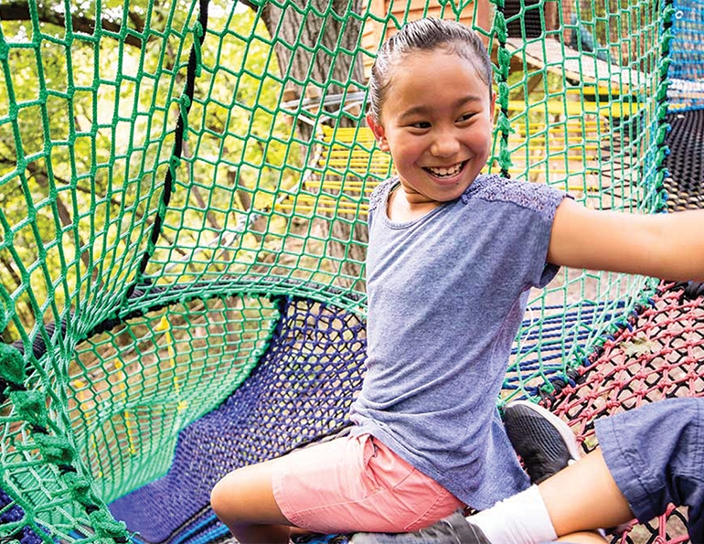 Smiles at the slide at Arbor Day Farms.